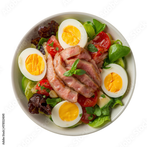 Delicious Salad With Sliced Meat, Boiled Eggs, and Fresh Vegetables Served in...