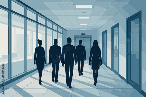 A group of business professionals walking down a modern, well-lit office corridor wearing formal attire.