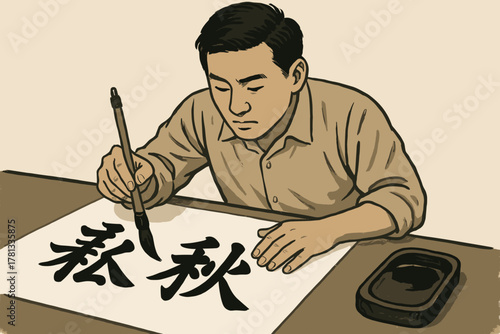 Asian male adult artist practicing calligraphy with a brush, focused intently on writing characters on a sheet of paper at a desk.