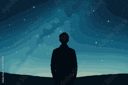 Silhouette of a person gazing at a starry night sky with a flowing milky way in the background.