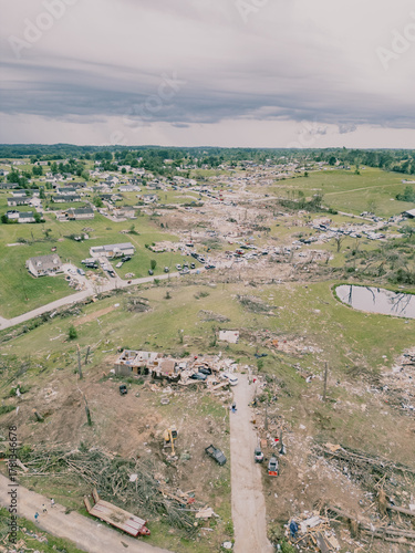 Aerial drone view of tornado-damage path through suburban neighbourhood