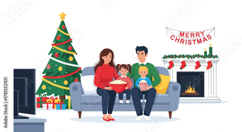 Happy family enjoying christmas movie night together on the couch with popcorn by the fireplace and tree