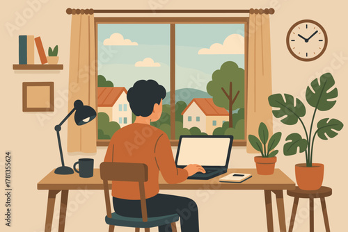 Young caucasian male sitting at a desk working on a laptop in a cozy home office with a view of houses and trees outside the window.