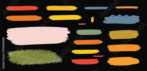 Abstract brush strokes and paint splatters on a black background, colorful and textured artistic elements