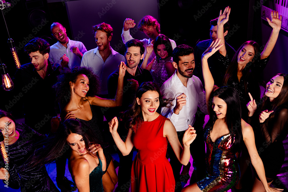 © deagreez - Celebration at the club with friends dancing under neon lights and bright smiles during a nighttime party © deagreez - Celebration at the club with friends dancing under neon lights and bright smiles during a nighttime party
