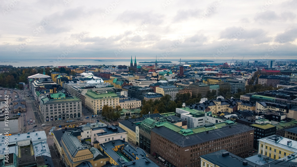 Fototapeta premium High-quality drone and street-level images of Helsinki, Finland, showing the city’s landmarks, harbor, and architectural details in natural northern light.