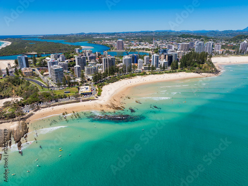 Aerial views of the Coolangatta coastline and skyline with Snapper Rocks and Rainbow Bay in the foreground and Fingal Head in the background