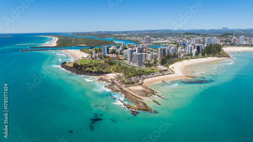 Aerial views of the Coolangatta coastline and skyline with Snapper Rocks and Rainbow Bay in the foreground and Fingal Head and Mount Warning in the background