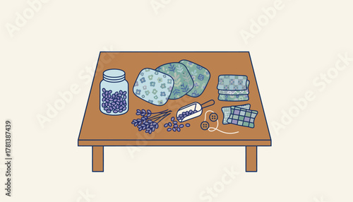 A crafting space with supplies for creating DIY scented sachets showcasing various fabric patterns and dried lavender.