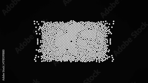 Countless white spheres on a black background creating dynamic patterns and shapes under the influence of an unseen magnetic force, demonstrating principles of physics and magnetism