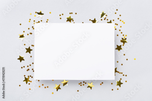 Golden star shape confetti on color background, top view