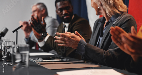 Bild auf Leinwand Press conference, applause and hands with group for delegation, international government and panel