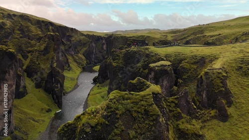 4k Aerial video of flying backwards in the beautiful fjadrargljufur canyon in southern Iceland a popular tourist destination. 
