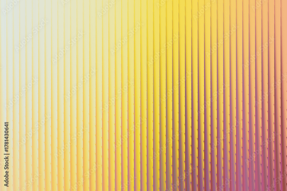 Fototapeta premium Abstract textured background with vertical lines in yellow, orange, and purple hues, creating a vibrant and dynamic visual effect with a subtle gradient