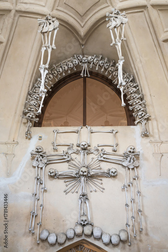 Angels and Cross skeletal decoration at Sedlec Ossuary, a 14th-century Roman Catholic chapel, located beneath the Cemetery Church of All Saints, part of the former Sedlec Abbey.