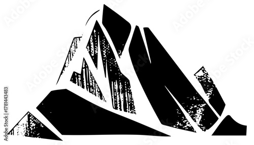 Mountains rise dramatically in a stark landscape