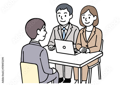 ノートパソコンで面接を行う男女スタッフ