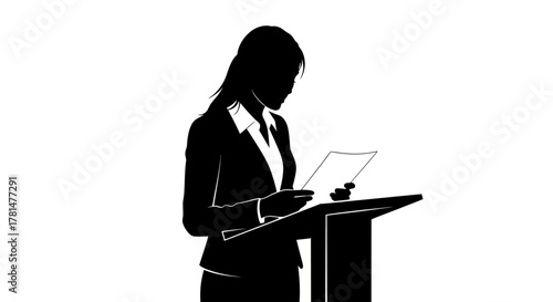Silhouette of a woman in a suit standing at a podium, reading from papers. Professional presentation concept