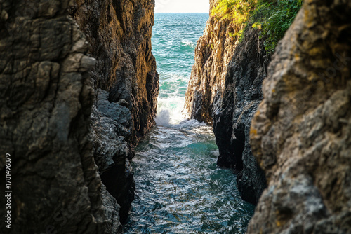 Fototapeta Naklejka Na Ścianę i Meble -  breathtaking view of the seas it crashes through narrow rock passageway