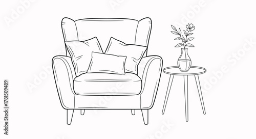 Armchair with pillows and flower vase on table furniture cushions