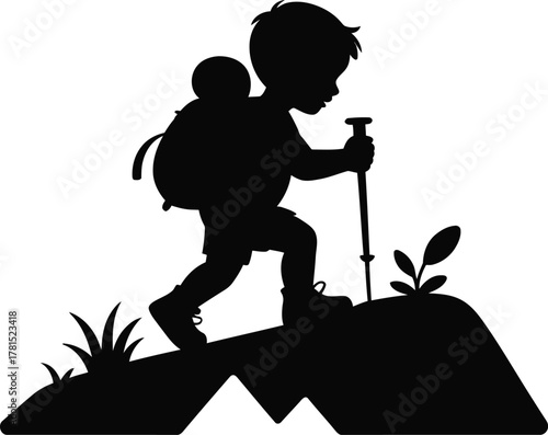 Silhouette of a young boy with backpack and trekking pole on an adventure