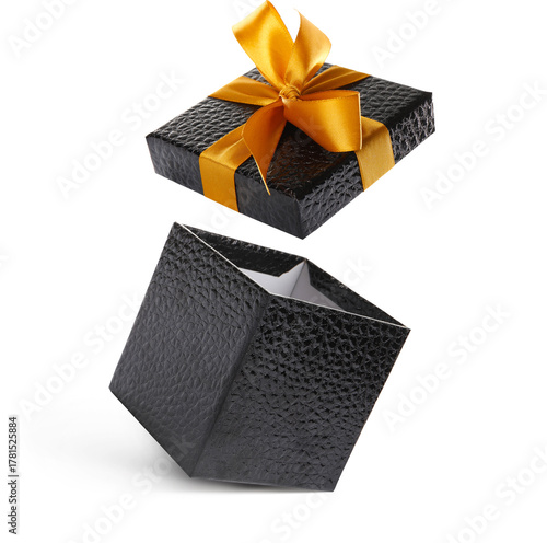 Open gift box with beautiful lid in air against white background