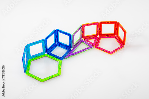 Step 1 – Colorful magnetic toy blocks connected on white background