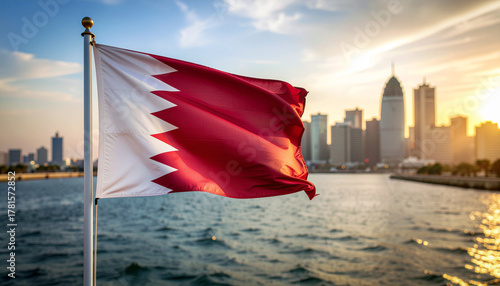 Bahrain flag gently waving with the city skyline at sunset, a symbol of national pride and identity in the vibrant Middle East
