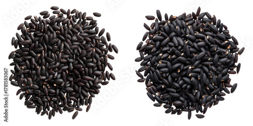 A close-up view of black rice grains, capturing the intricate details and textures of each individual grain. The dark color contrasts, showing a staple ingredient in various cuisines