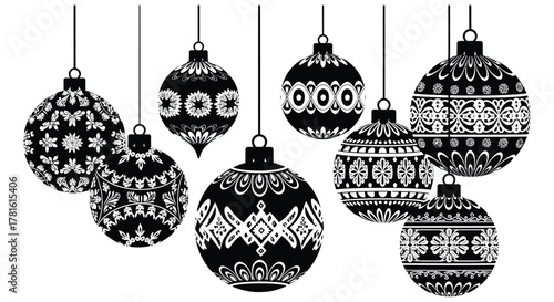 A collection of intricately patterned christmas ornaments hanging and displayed in a silhouette style
