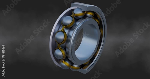Spinning ball bearing with a cross section showing detailed components including the inner and outer race, steel balls, and brass cage.
