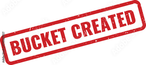 A distressed red rubber stamp impression clearly displays the digital text BUCKET CREATED for storage confirmation