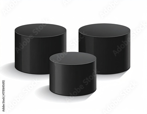 Three black cylinders, varying heights, with light shadows