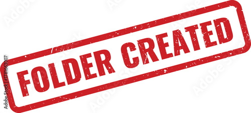 Red grunge rubber stamp impression clearly indicating a successfully created folder status for digital file management