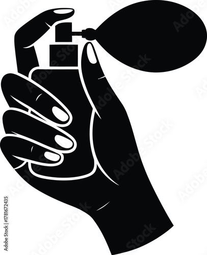Silhouette of a hand squeezing a vintage perfume atomizer bulb