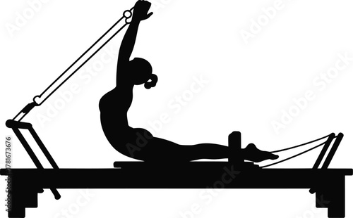 Woman performing pilates exercise on a reformer machine silhouette