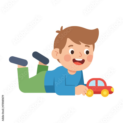 A young boy is happily playing with a toy car on the floor.