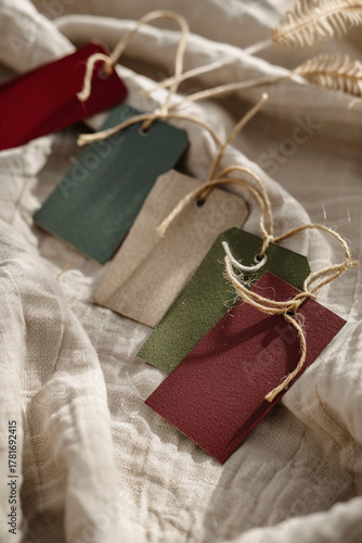 Scandinavian-Style Christmas Gift Tags on Beige Linen with Gold Strings, Cozy Warm Mockup