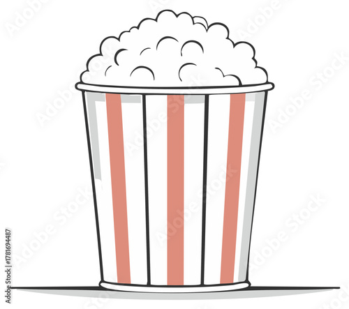 Classic red and white striped popcorn bucket brimming with fluffy movie theater snack