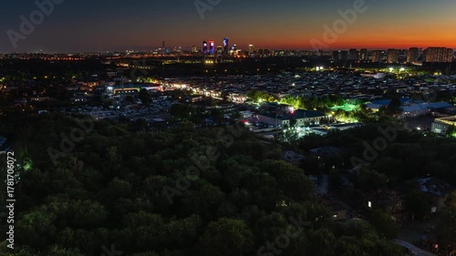 Time-lapse footage of Beijing, China, showing the old and new city districts at dusk with city lights turning on