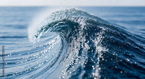 Fototapeta Naklejka Na Ścianę i Meble -  Crashing Ocean Wave Cresting in Deep Blue Sea Under Sunlight