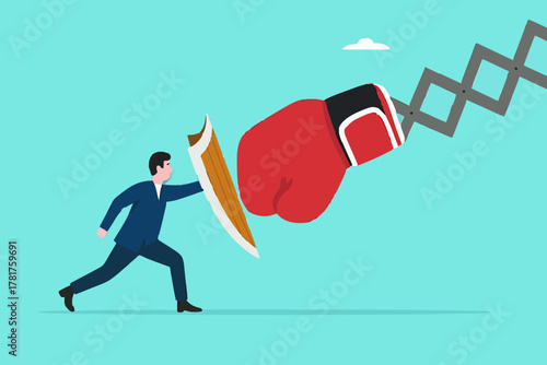 Business threat or problem, challenge or survive to win, survive and struggle to face business competition, defensive businessman using shield to face boxing glove with spring