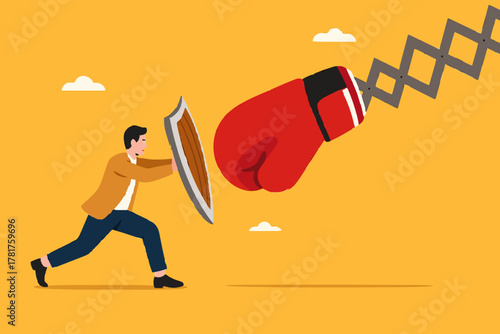 Business threat or problem, challenge or survive to win, survive and struggle to face business competition, defensive businessman using shield to face boxing glove with spring