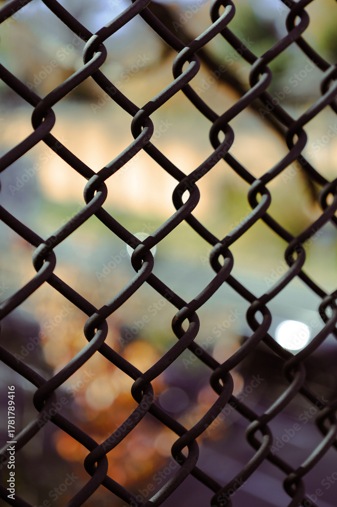 Fototapeta premium Chain link fence texture with blurred background