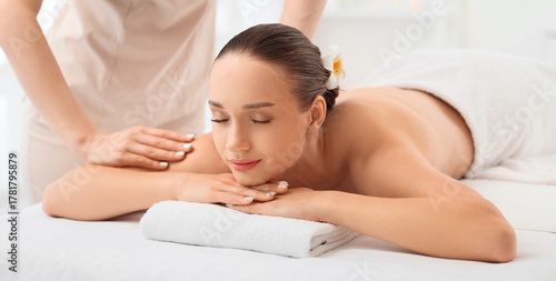 Massage therapist working w...