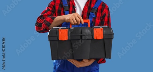 Male worker with tools box ...