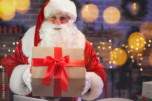Santa Claus holding Christm...
