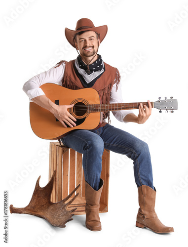 Handsome cowboy playing gui...