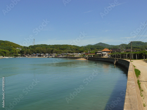 A panoramic view of the embankment of the fishing village located on the shore of the Inland Sea of Japan.