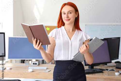 Female teacher with book an...